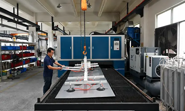 Worker handling equipment on a production machine